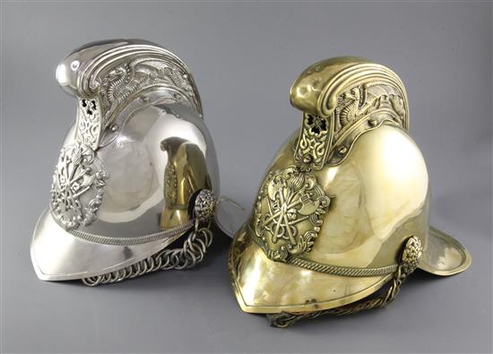 Two 19th century firemans helmets, height 10in.
